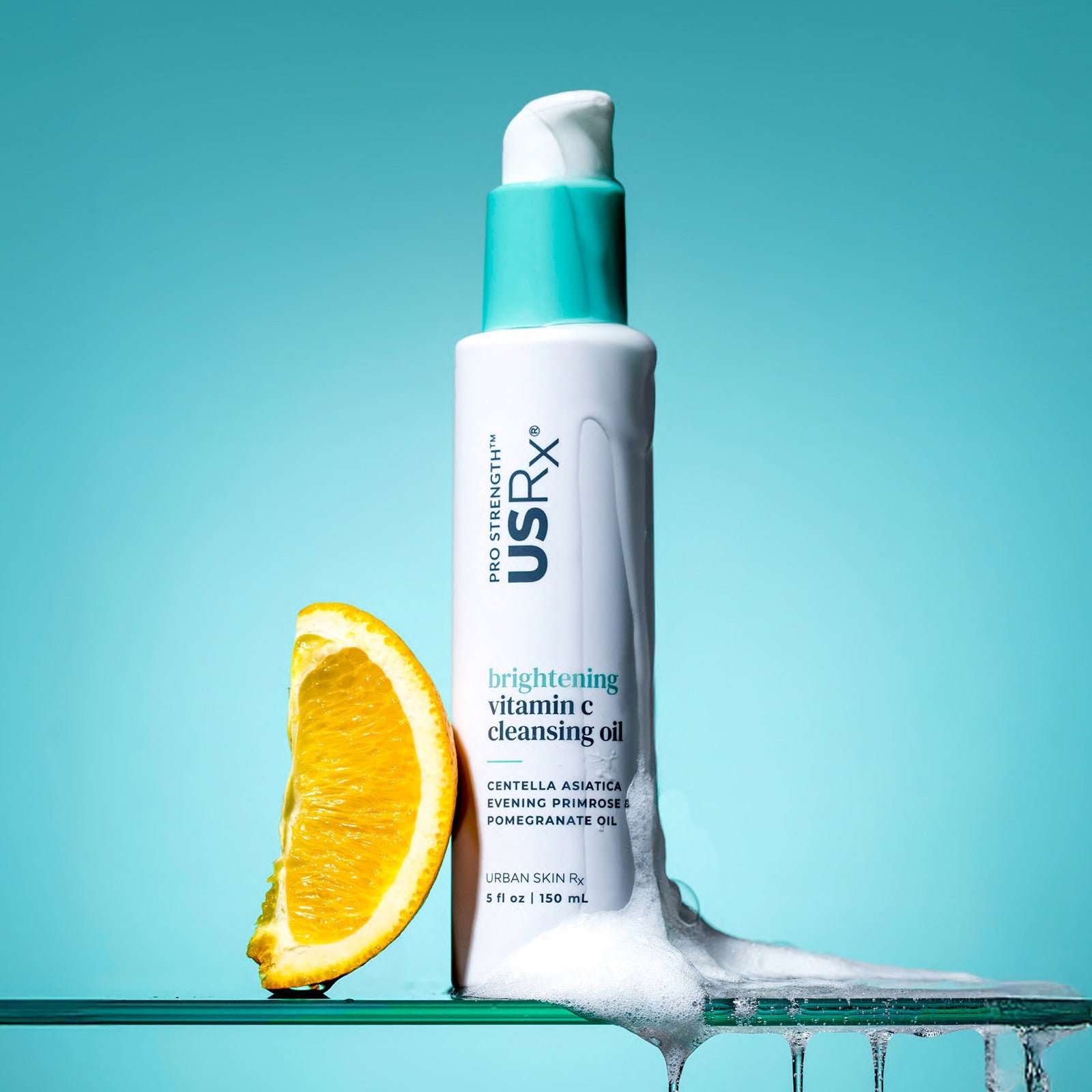 Bottle of USRx Vitamin C Cleansing Oil on a light blue background